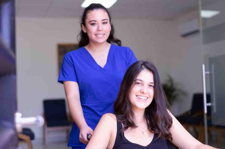 Nurse with patient in wheelchair