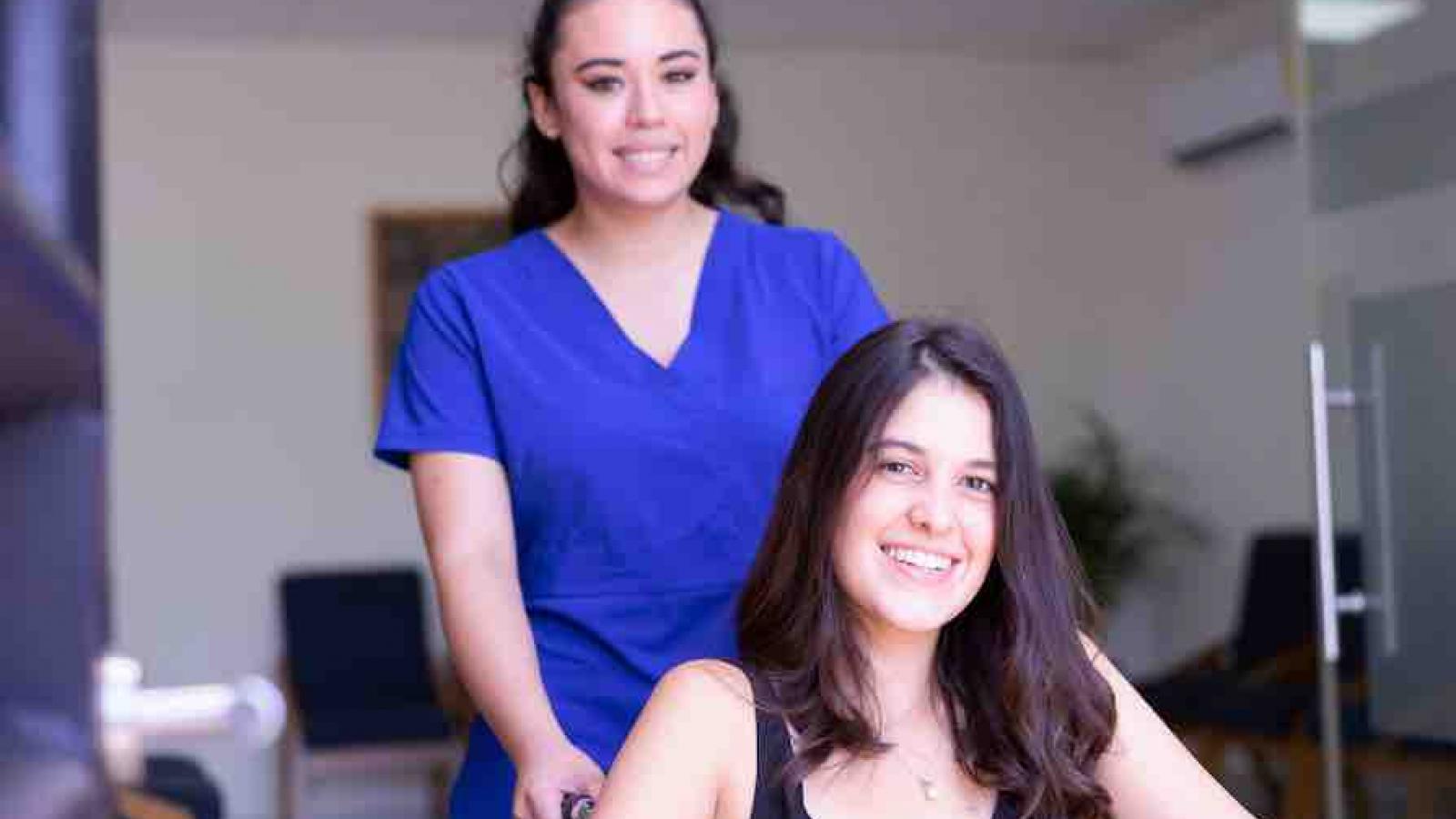 Nurse with patient in wheelchair