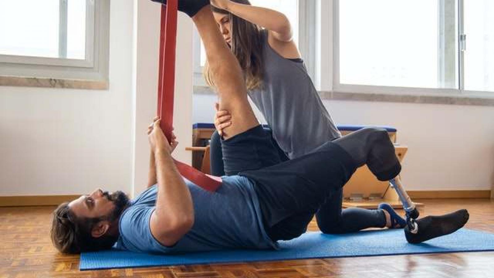 A physiotherapist working with a patient